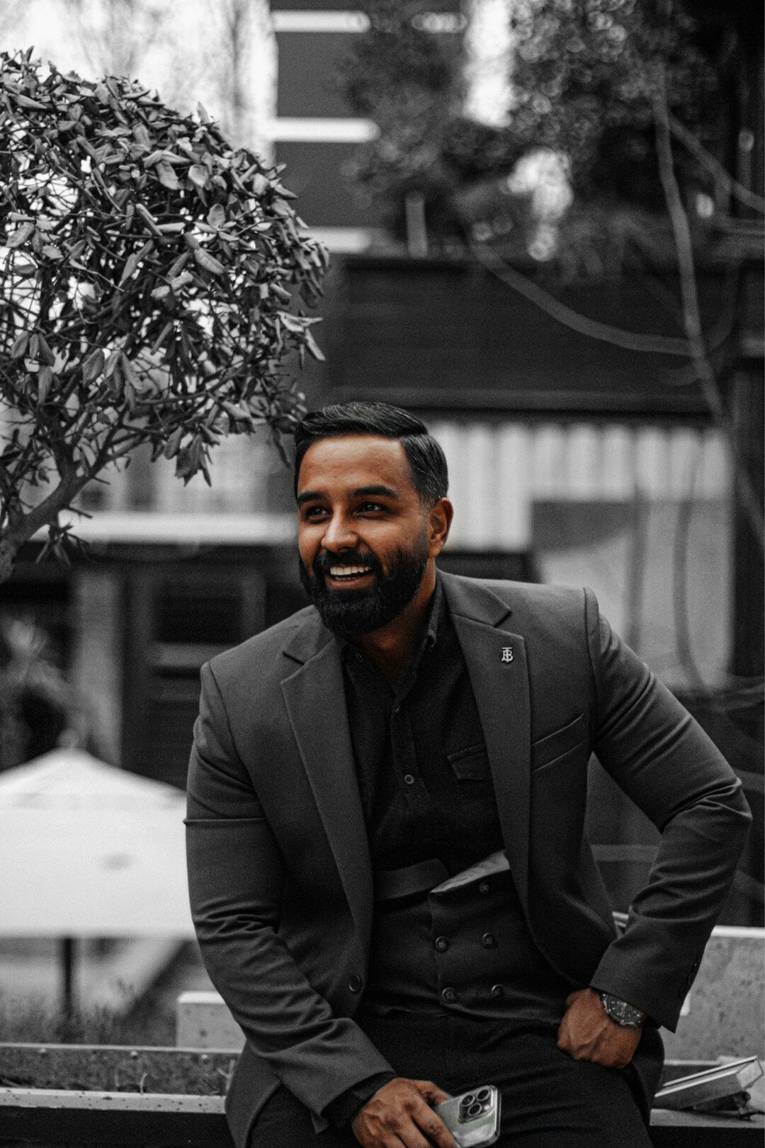 Danish male CEO in his 40s in a suit smiling